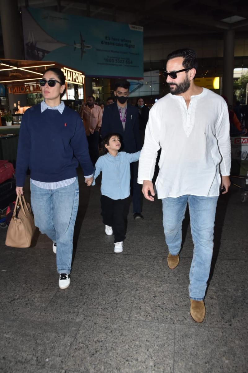 Here comes the Khan clan: Kareena Kapoor Khan arrives at the Mumbai airport with her husband, Saif Ali Khan, and her son, Taimur Ali Khan. While Kareena rocked a navy blue pullover along with a sky blue shirt and comfy blue boyfriend jeans, Saif opted for a spotless white short kurta and paired it up with sky blue jeans. We wonder what little Taimur is pointing at! 